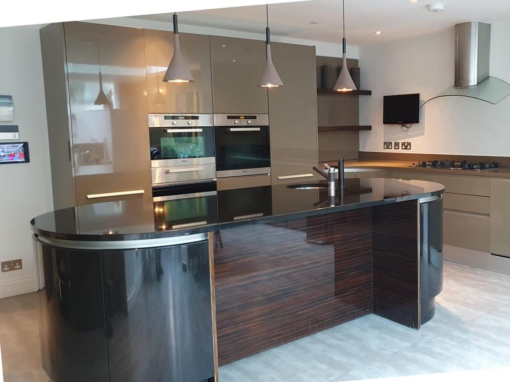 Pedini Kitchen with Miele Appliances & Black Granite/ Grey Composite Worktops. London. W9